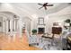 Open living space with hardwood floors, fireplace, and views into entryway at 1601 Dairyland Rd, Chapel Hill, NC 27516