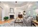Cozy living area boasting a fireplace, neutral color palette, and hardwood flooring at 1601 Dairyland Rd, Chapel Hill, NC 27516
