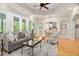 Bright living room with neutral decor, hardwood floors, and French doors to the outside patio at 1601 Dairyland Rd, Chapel Hill, NC 27516
