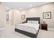 Comfortable bedroom featuring a large bed, neutral color palette, carpet and tasteful decor at 1601 Dairyland Rd, Chapel Hill, NC 27516