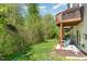 Spacious backyard features a patio, lush greenery, and mature trees at 162 Grey Elm Trl, Durham, NC 27713