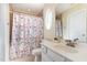Clean bathroom featuring a shower, vanity, and large mirror at 162 Grey Elm Trl, Durham, NC 27713