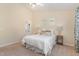 Bright bedroom with queen bed, ensuite bath and beige walls at 162 Grey Elm Trl, Durham, NC 27713