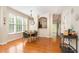 Elegant dining area with hardwood floors, pendant lighting, and a seamless flow into the kitchen at 162 Grey Elm Trl, Durham, NC 27713