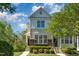 Beautiful two-story townhome with lush landscaping and a serene setting, capturing the essence of comfortable living at 162 Grey Elm Trl, Durham, NC 27713