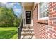 Inviting front entry with brick accents and decorative wreath, leading to a warm and welcoming home at 162 Grey Elm Trl, Durham, NC 27713