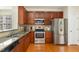 Well-appointed kitchen featuring stainless steel appliances, granite counters, and ample storage space, creating a functional layout at 162 Grey Elm Trl, Durham, NC 27713