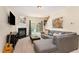 Comfortable living room features a fireplace, contemporary art, and a sliding door to outdoor space at 162 Grey Elm Trl, Durham, NC 27713