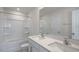 Bathroom features double sinks, white cabinets, and a tub with shower at 189 Calebs Corner Pl, Spring Lake, NC 28390