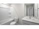 Bright bathroom features a shower-tub, white toilet and a vanity with bright mirror at 189 Calebs Corner Pl, Spring Lake, NC 28390