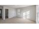 A well-lit bedroom with a neutral carpet and attached bathroom at 189 Calebs Corner Pl, Spring Lake, NC 28390