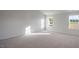 Bright bedroom features two windows offering natural light and neutral carpeting at 189 Calebs Corner Pl, Spring Lake, NC 28390