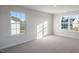 Bright bedroom features two windows offering natural light and neutral carpeting at 189 Calebs Corner Pl, Spring Lake, NC 28390