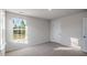 Bedroom features a window offering natural light, neutral carpeting and a closet at 189 Calebs Corner Pl, Spring Lake, NC 28390