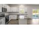 Bright kitchen with an island, granite countertops, and stainless steel appliances at 189 Calebs Corner Pl, Spring Lake, NC 28390