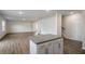 Open concept living room with hardwood floors and access to dining and kitchen at 189 Calebs Corner Pl, Spring Lake, NC 28390