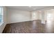 Open concept living area with wood-look flooring and natural light at 189 Calebs Corner Pl, Spring Lake, NC 28390