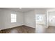 Spacious living room boasts wood-look floors and ample natural light at 189 Calebs Corner Pl, Spring Lake, NC 28390