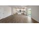 Spacious living room with hardwood floors and an open floor plan leading to the kitchen at 189 Calebs Corner Pl, Spring Lake, NC 28390