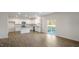 Open concept living room and kitchen featuring hardwood floors and natural light at 189 Calebs Corner Pl, Spring Lake, NC 28390