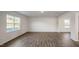 Large living area featuring wood-look floors and plenty of natural light at 189 Calebs Corner Pl, Spring Lake, NC 28390