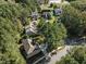 An aerial shot showcasing homes in a neighborhood, surrounded by lush trees and well-maintained landscaping at 2 Piney Ridge Ct, Durham, NC 27712