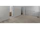 Carpeted bedroom with ensuite bath and multiple closets at 2 Piney Ridge Ct, Durham, NC 27712