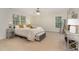 Bright bedroom with neutral walls, carpet, ceiling fan and well-lit windows at 2 Piney Ridge Ct, Durham, NC 27712