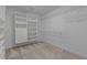 Walk-in closet with installed shelves, drawers and hanging rods at 2 Piney Ridge Ct, Durham, NC 27712