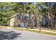 Two-story house with a front porch, two-car garage, mature trees and a fire hydrant on the property line at 2 Piney Ridge Ct, Durham, NC 27712