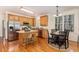 Modern kitchen featuring stainless steel appliances, granite countertops, and kitchen island at 2 Piney Ridge Ct, Durham, NC 27712
