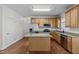 Bright kitchen with stainless appliances, granite countertops, and center island at 2 Piney Ridge Ct, Durham, NC 27712