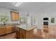 Open kitchen featuring granite countertops, stainless steel appliances, and hardwood flooring at 2 Piney Ridge Ct, Durham, NC 27712