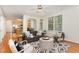 Open-concept living room with stylish furnishings, hardwood floors, and view to the kitchen at 2 Piney Ridge Ct, Durham, NC 27712