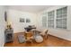 Bright office space featuring hardwood floors, a large window, and tasteful decor at 2 Piney Ridge Ct, Durham, NC 27712