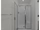 Modern shower with glass doors and a built-in seat at 2 Piney Ridge Ct, Durham, NC 27712