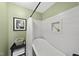 Bright bathroom featuring a standalone tub, white shiplap walls, and a built-in niche at 205 W Moore St, Apex, NC 27502