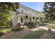 Charming home featuring a welcoming porch, swing, and meticulous landscaping at 205 W Moore St, Apex, NC 27502