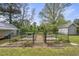 Enclosed garden with raised garden beds and brick pathway at 205 W Moore St, Apex, NC 27502