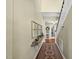 Charming hallway with hardwood floors, an antique rug runner, and decorative wall accents at 205 W Moore St, Apex, NC 27502