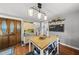 Kitchen island with wood countertop, unique doors, and open shelving under modern lighting at 205 W Moore St, Apex, NC 27502
