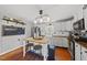 Bright kitchen featuring stainless steel appliances and an island with seating and wood countertops at 205 W Moore St, Apex, NC 27502