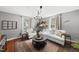Inviting living room featuring a striped sofa, area rug, and decorative accents under natural light at 205 W Moore St, Apex, NC 27502