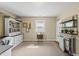 Bright home office featuring hardwood floors, built-in shelving, and a view from the window at 205 W Moore St, Apex, NC 27502