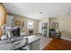 Home office featuring hardwood floors, a large desk, and lots of natural light at 205 W Moore St, Apex, NC 27502