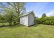 White outdoor shed with batten doors at 205 W Moore St, Apex, NC 27502
