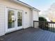 Exterior view of a wooden deck with double doors leading into the house at 211 Milky Way Dr, Apex, NC 27502
