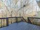 Wooden deck overlooks trees and wooded area in backyard at 211 Milky Way Dr, Apex, NC 27502