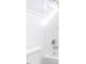 Bright bathroom featuring a white toilet, a shower and tub combo with shiny chrome fixtures at 211 Milky Way Dr, Apex, NC 27502