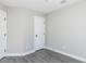 Cozy bedroom features gray flooring and a door to a closet at 211 Milky Way Dr, Apex, NC 27502
